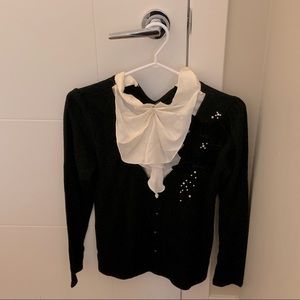 Cute fancy black cardigan with stuck on white puffy lace